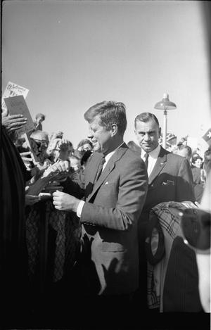 [President Kennedy greeting the crowd at Love Field]