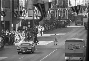 [Crowd on Main Street waiting for the Kennedy motorcade]
