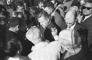 [Senator Ralph Yarborough surrounded by press outside Parkland Hospital]