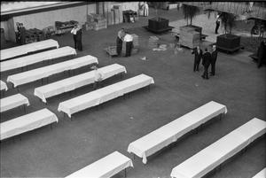 [Banquet tables being set up at the Dallas Trade Mart]