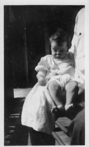 [Mary Jones at four months old, sitting on a man's lap]