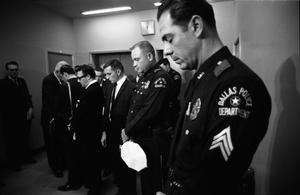 [Dallas Police officers observing a moment of silence for Officer Tippit]