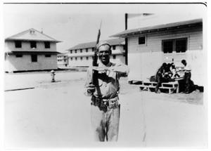 Primary view of object titled 'Soldier posing with his bayonet at Camp Wallace'.