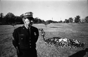 [A Fort Worth Police officer guarding Lee Harvey Oswald's grave]