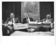 Thumbnail image of item number 1 in: '[Lamar Fleming, Jr. seated with Mr. Erickson and Mr. Kleberg in meeting with tapestry in background]'.