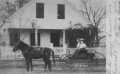 Primary view of [Della and Therese Wilson in a carriage in front of home in Brazoria, TX]