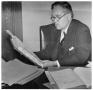 Thumbnail image of item number 1 in: '[George A. Hill, Jr. sitting at desk reading book]'.
