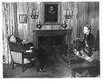 Thumbnail image of item number 1 in: '[George A. Hill, Jr. and Mary Hill with fireplace in background]'.
