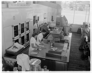 Primary view of object titled '[People working inside the 2-J Hamburger Store]'.