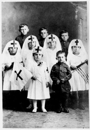 Primary view of object titled '[School children dressed in WWI Red Cross and Army uniforms]'.