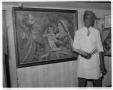 Primary view of [Charlie Clifton Cain Jr. standing next to painting]
