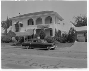 Primary view of object titled '[A hearse parked in front of Weed-Corley Funeral Home]'.