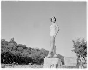 [Woman posing with heels and swimsuit]