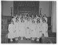 Photograph: [Nurses posing for group photo with clergyman]