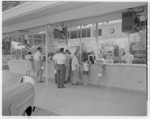 Primary view of object titled '[People waiting in line at 2-J Hamburgers]'.