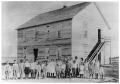 Thumbnail image of item number 1 in: '[Young School Children in Front of School Building]'.