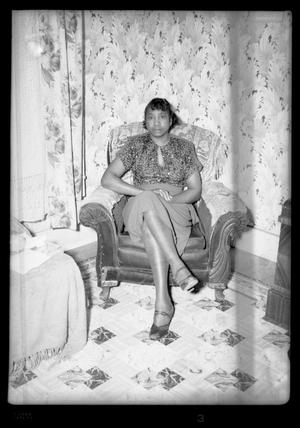 [Photograph of a Woman Sitting in a Chair]