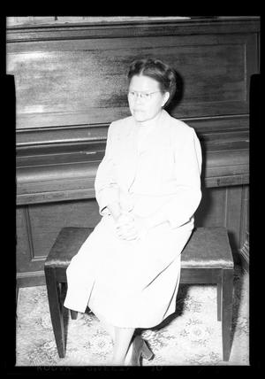 [Photograph of a Woman Sitting at a Piano]