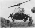 Photograph: Soldiers Jumping out of a Helicopter in Combat