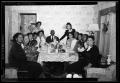 Photograph: [Photograph of People Sitting at a Dining Table]