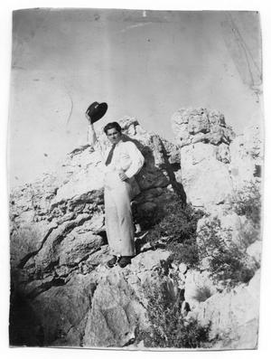 Man on Rock With Hat