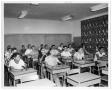 Photograph: Students in classroom inside Kramer Hall