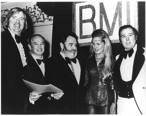 [Photograph of Bill Hall With a Group at a BMI Event]