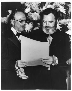 [Photograph of Bill Hall Holding a Paper with Another Man]