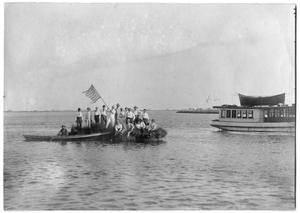 Primary view of object titled '[Photograph of Men Celebrating on a Small Island, 1899]'.