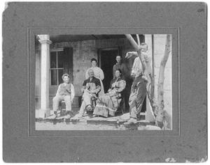 [Photograph of a Family on a Porch]