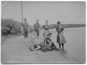 [Photograph of People on a Shoreline]