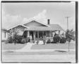 Photograph: [House with man and woman standing in front]