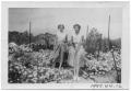 Photograph: [Two Women in Flower Bed]