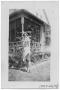 Photograph: [Woman in Front of House]