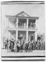 Photograph: [Large Group in Front of Boarding House]