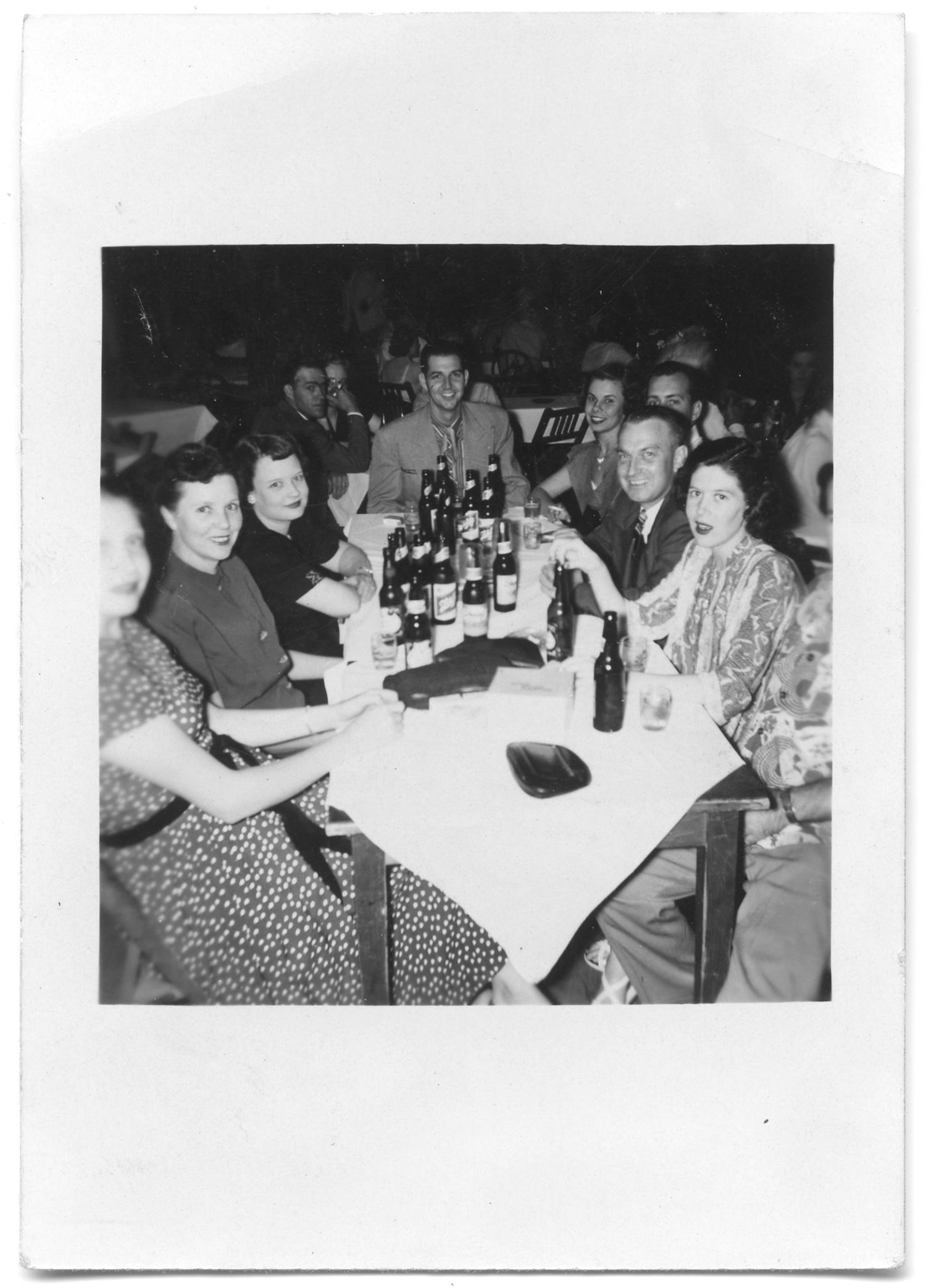 [Photograph of A Group at a Table in Dessau Hall]
                                                
                                                    [Sequence #]: 1 of 2
                                                
