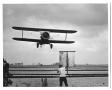 Thumbnail image of item number 1 in: '[Airplane Seeding a Field]'.
