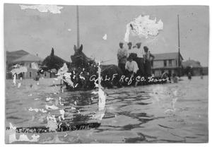 [Horse-Drawn Carriage Through Flood Waters]