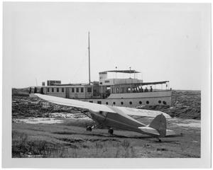 [Small Plane and Boat]