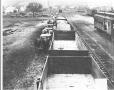 Photograph: [Unloading Grain From Box Cars]