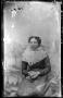 Photograph: [Woman seated in a chair]