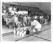 Photograph: [Photograph of Students Learning How to Bowl at a School Gym]