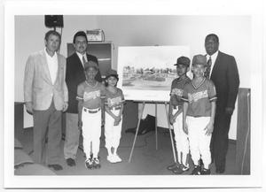 [Photograph of a Group of People With Plans for a Rangers Ballpark]