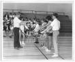 Photograph: [Photograph of Students Learning Badminton Serves]