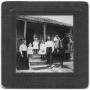 Photograph: [Family standing on porch]