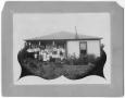 Photograph: [Large group in front of house]