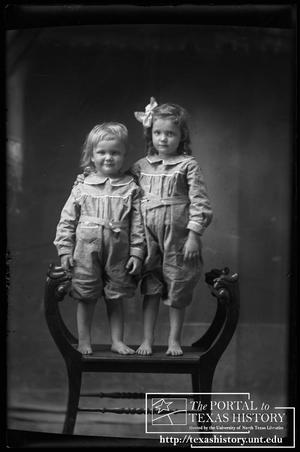 Primary view of object titled '[Two children posed in bare feet]'.