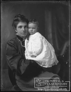 [Gertrude Snearly Kelley holding a baby]