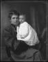 Photograph: [Gertrude Snearly Kelley holding a baby]
