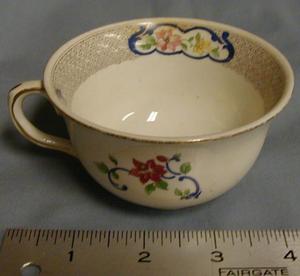 [John Maddock and Sons Royal Vitreous coffee/tea cup with gold rim]